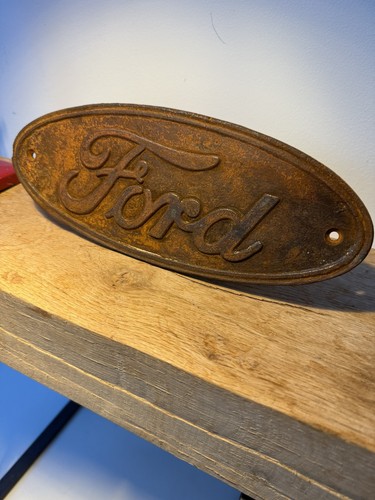 Rusty ford oval cast iron - ford,